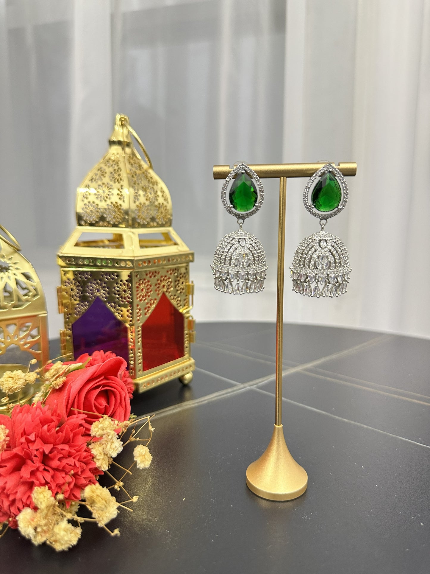 Traditional Silver Jhumka Earrings with Emerald Green Teardrop Stones